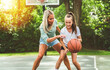© Louis-Paul Photo - Mother and little daughter play basketball outside