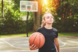 © Louis-Paul Photo - girl with basketball on court on summer season