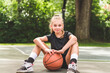 © Louis-Paul Photo - girl with basketball on court on summer season