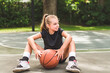 © Louis-Paul Photo - girl with basketball on court on summer season