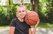 © Louis-Paul Photo - girl with basketball on court on summer season