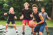 © Louis-Paul Photo - great child Team in sportswear playing basketball game