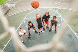 great child Team in sportswear playing basketball game
