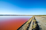 Fototapeta Pomosty - Lake Atanasovsko, Burgas, Bulgaria - Extraction of sea salt and lye. Selective focus.