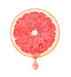 Slice of grapefruit with drop of juice cut out