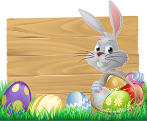 Wall Mural - Easter wood sign with the Easter bunny and painted Easter eggs