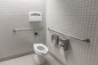 Handicap accessible bathroom in compliance with ADA American with Disabilities act allowing handicapped people to safely use public restroom
