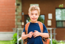 Portrait Of A Little Schoolboy With Down Syndrome