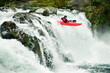 © Cavan Images - Whitewater kayaker descending waterfall in forest