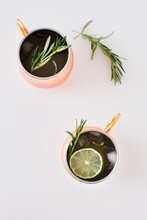Overhead View Of Rosemary And Lemon In Drink On Table