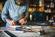 © Cavan Images - Man working in workshop