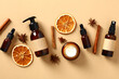 Leinwandbild Motiv Set of fall natural skincare cosmetics with dried orange slices, cinnamon sticks, anise stars. Amber glass bottes packaging design.