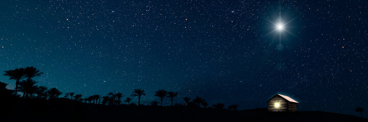 the star shines over the manger of christmas of jesus christ. panorama