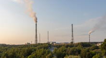 Industrial Landscape. Ecological Catastrophy. Smoking Chimneys Of The Factory On The Background Of Nature.
