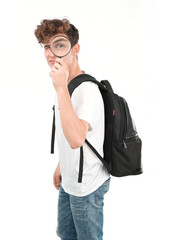 Concentrated young student using a magnifying glass