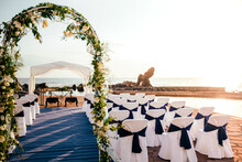 Chairs Arranged By Sea For Wedding Ceremony