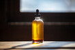 © Cavan Images - Close-up of oil bottle on wooden table at home