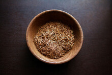 Overhead View Of Herbs In Wooden Bowl On Table