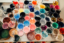 High Angle View Of Messy Watercolor Paint Glasses