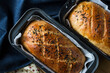 © Cavan Images - Overhead view of fresh baked breads in baking sheets at home
