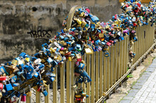 Various Love Locks On Metallic Railing Of Charles Bridge In City