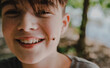 © Cavan Images - Close-up portrait of happy boy with insect on face