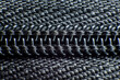 © Cavan Images - Close-up of black plastic zipper