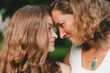 © Cavan Images - Close-up of mother and daughter looking at each other in park
