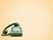 © Cavan Images - Vintage telephone against beige background