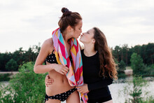 Two Girls Kissing On The Beach