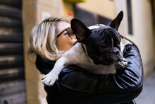 Woman Is Keeping A French Bulldog