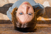 Upside-down Portrait Of A Girl With Blue Eyes