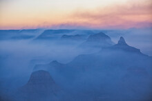 Silhouette Of The Rocks Among The Smoke In The Grand Canyon