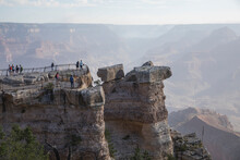 People Watching The Grand Canyon From A Viewpoint