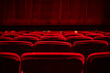 © Cavan Images - Red seats and curtains of an empty theater