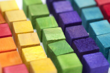 Colorful Arrangement Of Wooden Building Blocks Or Cubes In Neat Rows Ordered By Color In A Full Frame Background