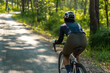 © torwaiphoto - Asian woman riding a bicycle road bike