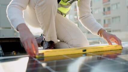 Wall Mural - Photovoltaic, solar panel and hands of maintenance worker using a building level ruler during inspection. Solar energy, renewable energy and man doing checkup of electricity sustainability innovation