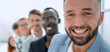 © ASDF - multiethnic corporate business people standing on office looking