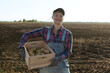 © руслан малыш - Happy smiling caucasian female potato farmer or gardener. Agriculture - food production, harvest concept