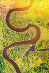 Wall Mural - Aerial View Of Summer Curved River Landscape. Top View Of Beautiful European Nature From High Attitude. Drone Flight View. Bird's Eye View Of Green Forest Woods In Sunny Day. River Forms Sign S.