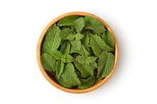 Fresh Mint Leaves In Wooden Bowl On White Background