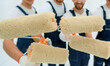 © ASDF - closeup.a team of builders with paint rollers.i