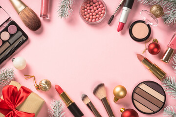 Poster - Make up cosmetic products and christmas decorations at pink. Christmas sale or christmas gift concept. Flat lay image with copy space.