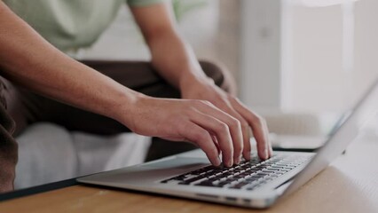 Poster - Freelancer hands typing on a laptop with a remote job working in his living room. Closeup of a creative man doing research on the internet or planning a freelance project with a computer.
