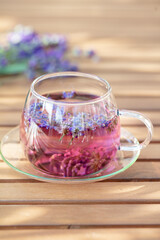 Wall Mural - Glass cup of lavender tea.