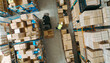 © Jacob Lund - High angle view of a warehouse employee moving goods
