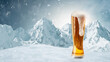 Winter vacations. Big glass of light cold foamy beer over snow-capped mountains background. Holidays, vacation, drinks, taste, ad