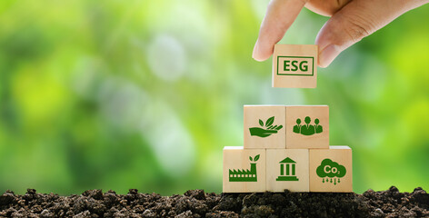 esg concepts on environment, society and governance sustainable corporate development hand holding a