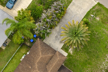 Wall Mural - Aerial view of typical contemporary american private house with roof top covered with asphalt shingles and green lawn on yard